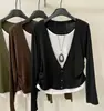 Camiseta de manga larga de color liso estilo coreano, una nueva colección de otoño con corte holgado, efecto adelgazante y diseño versátil, disponible en tallas grandes para mujer