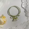 Flor Verde e Fresca do Anel Verão Mori Alta Qualidade Borracha de Alta Elasticidade Tendão Cabeça de Arco de Alto Valor Corda