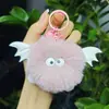 Nuevo colgante de peluche de diablito bola de carbón imitación de pelo de conejo rex para llavero de coche, colgante para mochila escolar, venta al por mayor