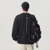 Camiseta de algodón de manga larga para hombre, peso pesado, marca de tendencia estilo americano, nueva colección otoño 2026, cuello redondo, versátil y moderna, venta al por mayor