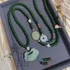 Estilo Chino Nuevo estilo chino retro Patrón de espalda de jade Hebilla de seguridad Cadena cruzada Collar Borla Colgante de jade Cuentas redondas verdes para mujer