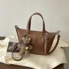 Bolsa tote pequena retrô de alta qualidade para mulheres 2026 nova bolsa simples versátil de ombro único bolsa transversal casual da moda bolsa bolinho