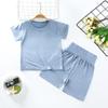 Nuevo traje de camiseta modal de manga corta para niños de verano para niños y niñas, conjunto de dos piezas de ropa para el hogar de cintura alta, una generación de cabello