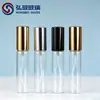 Botella de perfume de 10 ml con pulverizador de vidrio y boquilla de aluminio anodizado dorado.