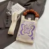 Bolso de Mano de Punto de Nuevo Estilo Color Dopamina Bolso de Almacenamiento Versátil de Nicho Bolso Pequeño de Punto Cruzado