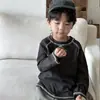 Camiseta de algodón puro para niños, estilo primavera y otoño 2026 para bebés y niños pequeños, top con graffiti versión coreana, camiseta interior de manga larga para niños
