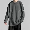 Camiseta de manga larga para hombre, adecuada para primavera y otoño, corte holgado, cuello redondo, capa interior fina, base elástica, versátil y moderna