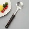 Suministro directo de fábrica mango con veta de madera acero inoxidable pelador creativo para colgar en la pared electrodomésticos de cocina para el hogar