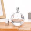 Venta al por mayor de fábrica botella de perfume de vidrio blanco fino de 75 ml botella de perfume redonda botella de spray hidratante botella vacía