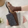 Calcetines florales estilo MIU de principios de otoño, para mujer, en un estilo retro coreano, de longitud media hasta la pantorrilla, versátiles, amigables con la piel y con una sensación de alta gama, con un diseño de volantes