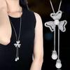 Cadena de suéter larga cruzada espejo para mujer, collar largo de tulipán, accesorios colgantes para ropa de temperamento, fabricantes venden