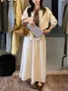 2025 Novo Conjunto de Duas Peças Outono e Inverno: Suéter Cardigan de Seda com Gola V Solto Estampado de Leopardo + Saia de Tricô de Cintura Alta para Mulheres
