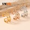Anillo de acero inoxidable con forma de cruz, popular en Europa y América, para mujer, con presión de aceite, doble giro, anillo ajustable, venta al por mayor