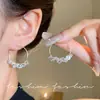 Pendientes de anillo liso exagerado con aguja de plata S925 de estilo europeo y americano para mujer, pendientes de temperamento simple Joker de lujo ligero de alta gama, venta al por mayor