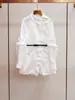 Shenzhen Nanyou roupa feminina de ponta novo design estilo francês lapela orelha de madeira carcela enviesada manga comprida abotoamento simples camisa saia