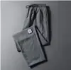 Pantalones Casuales de Lino Delgado de Seda Helada Nuevos de Verano para Hombre, Pierna Recta con Etiqueta, Estilo Coreano, Corte Holgado, Talla Grande, Pantalones Deportivos Acortados