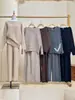Conjunto de punto de estilo elegante y relajado, nueva colección otoño/invierno 2026, suéter de punto de cuello redondo liso y pantalones de pierna ancha, conjunto de dos piezas para mujer