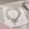 Pulseira de Pérolas com Laço Duplo de Zircônia Francesa Design de Senso Nicho de Luxo Leve Joia de Mão Simples e Exquisita