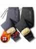 Venta al por mayor transfronteriza Pantalones cálidos gruesos con forro polar de lana de cordero Pantalones de algodón cortavientos Sueltos talla grande Casual Invierno Hombres