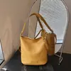 Bolso de mujer versátil de gran capacidad de moda transfronteriza 2026 verano nuevo simple para el trabajo al hombro cruzado tipo cubo
