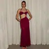 Nuevo producto de otoño estilo europeo y americano, falso dos piezas de color liso, diseño que revela la cintura, atuendo sexy de chica caliente, vestido sin espalda con cuello halter para mujer
