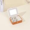 Caja de almacenamiento de anillos de moda con espejo de cuero, mini caja portátil para joyas, pendientes, collares y joyas, disponible al por mayor.