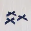 Venta al por mayor del fabricante Accesorios de moño de cinta de 1 cm DIY Semiacabado Pastel de cumpleaños Ropa interior Calcetines Moño hecho a mano