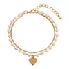 Pulsera apilable de perlas de estilo nuevo de lujo nicho coreana y japonesa con colgante de corazón de moda retro versátil pulsera de doble capa