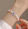 Pulsera francesa con incrustaciones de perlas de imitación, para mujer, elegante, de temperamento suave, lujo ligero, joyería de mano, pulsera blanca al por mayor