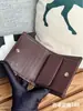 Billetera corta de cuero de vaca de primera capa con patrón de bola de Xiaoxiang, plegable a la mitad, con monedero dentro de la billetera, súper práctica, de alta gama, marca grande