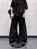Jeans masculino de modelagem larga e despojada, estilo americano resistente e descolado, com patchwork de três listras e design curvo.