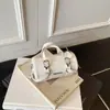 Bolso de Mano Portátil Transfronterizo Mini para Mujer, Nicho Lujo Ligero Moda Elegante para Viajar Mini Bolso Cruzado Cubo para Niños Tendencia