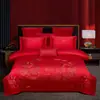 Juego de ropa de cama de lujo estilo chino, hecho de algodón 100% de fibra larga, un juego de cuatro piezas que incluye una sábana y una funda de edredón de algodón puro rojo, perfecto para la alcoba de una recién casada.