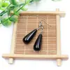 Venta al por mayor de fábrica aretes largos de cristal natural forma de gota de agua amatista Ojo de Tigre Joyería con gancho para la oreja aretes redondos de gota de agua DIY