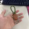 Llavero de cuerda tejida a mano de cuero para coche personalidad creativo colgante de llave patrón de texto imprimible venta al por mayor de fábrica