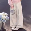 Conjunto de Primavera e Outono para Meninas 2026: Top Patchwork com Laço Combinado com Calça Casual Versátil de Cor Sólida e Perna Larga, Tendência