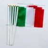 Banderas de mano con mástil en stock transfronterizas de todo el mundo, hechas a medida según su diseño, Banderas coloridas de poliéster para la Copa del Mundo de EE. UU.-Canadá-México