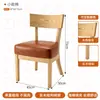 Mesa de comedor estilo sudeste asiático con asientos de banco, sillas sencillas de madera maciza estilo pastoral, adecuada para restaurantes de té y tiendas de postres, con una mesa larga de losa de roca y sofá doble