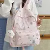 Mochila para estudiantes de preparatoria y universidad con graffiti transfronterizo, mochila versátil de nicho con estampado de estrellas, mochila de gran capacidad para mujer
