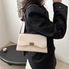 Moda nicho de alta gama 2025 nuevo color sólido simple versátil hombro commuter retro bolso sobaco transfronterizo