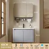 Tocador de baño engrosado y ahorrador de espacio con diseño en color crema, que cuenta con un lavabo redondeado, lavabo cerámico integrado y un lavabo de una sola pieza.