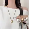 Collar minimalista de cordón negro con colgante de gota de agua ovalada cepillada para mujer, estilo coreano, cadena larga ajustable para suéter, accesorio elegante y versátil