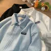 Suéter Retro Estilo Americano Cuello Polo para Hombre Otoño e Invierno Nuevo Holgado Oversize Sentido Avanzado Estilo Universitario Chaqueta con Solapa