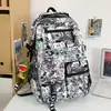 Mochila Escolar 2026 Novo Estilo Mochila com Grafite de Desenho Animado para Meninos do Ensino Fundamental, Mochila de Nylon Tendência de Grande Capacidade