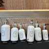Botella de Repuesto de Fragancia Francesa 500ml Blanco Porcelana Botella de Plástico con Pulsador Baño de Hotel Premium Champú Aceite de Té Sub-paquete