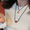 Collar con colgante de cinabrio natural. Este collar de un año de vida protege el cuerpo. Cadena de suéter de transferencia. Regalo.