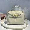 Bolso Tote de Cuero Genuino de Gran Capacidad Nuevo de Otoño Hebilla de Cuerda Metálica de Nicho Bolso Cruzado de Hombro Tejido para Mujer