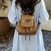 Mochila para mujer de uso diario 2026 linda nueva de dibujos animados invierno de un solo hombro estampado de leopardo estilo coreano y japonés gamuza bandolera bolso de mano de doble hombro