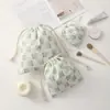 Bolsa con cordón de dibujos animados Bolsa de almacenamiento para estudiantes Bolsa de maquillaje para lápiz labial Neceser Juego de tres piezas Almacenamiento para mujer Patchwork