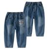 Jeans de niño 2025 Primavera y Otoño Pantalones nuevos para niños Jeans de color puro con dibujos animados para bebé para ropa exterior